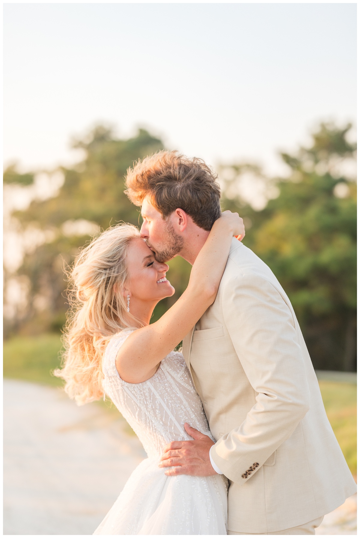 Eastern Short LDS First Look groom kissing brides forehead
